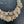Load image into Gallery viewer, Gold bracelet with intricate design on a dark background
