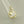 Load image into Gallery viewer, Gold ring with diamond accents on a light gray background
