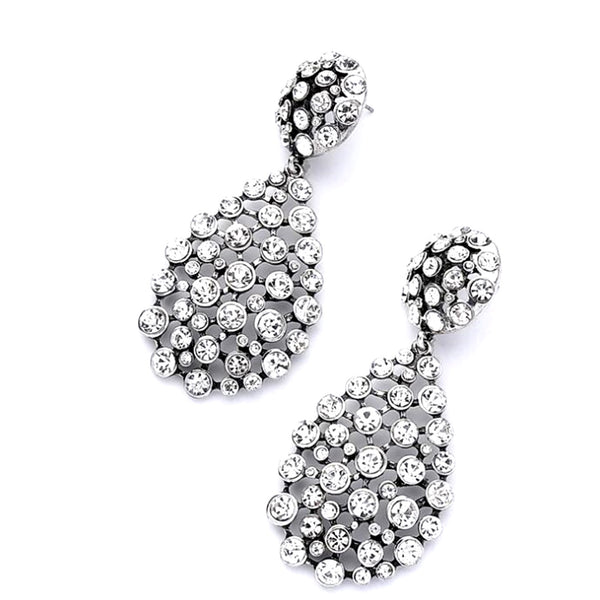 Pair of silver earrings with clear gemstones on a white background
