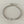 Load image into Gallery viewer, A silver chain bracelet with a rectangular bar engraved with the word 'GOODLUCK', displayed on a textured gray stone surface.
