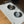 Load image into Gallery viewer, Cat eating from a bowl on a patterned mat with 'unikook' branding.
