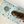 Load image into Gallery viewer, Dog drinking from a bowl on a terrazzo-patterned mat with 'uniklook' branding.
