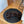 Load image into Gallery viewer, Dog lying on a black pet bed on a wooden floor
