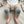 Load image into Gallery viewer, Baby wearing gray knitted knee pads on a light-colored surface
