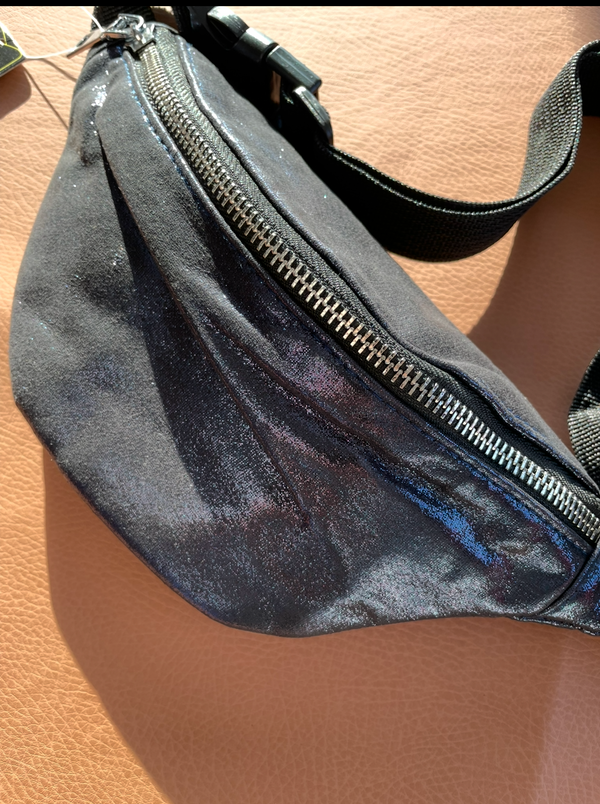 blue waist bag on a wooden surface