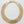 Load image into Gallery viewer, A wide, multi-strand gold chain necklace with a geometric, textured chevron pattern, displayed on a dark brown wooden surface.

