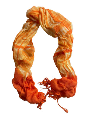 Orange and yellow scarf on a white surface