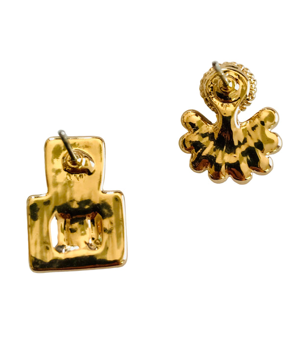 Gold square and floral earrings on a white background