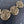 Load image into Gallery viewer, Bronze spiral necklace on a dark textured background
