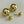 Load image into Gallery viewer, Gold spherical earrings on a light gray background
