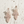 Load image into Gallery viewer, Rose gold earrings on a light wooden surface
