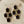 Load image into Gallery viewer, Hexagonal earrings with black stones on a wooden surface
