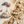 Load image into Gallery viewer, Pearl earrings on a textured surface with stones and shells
