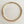 Load image into Gallery viewer, A gold-toned snake chain necklace arranged in a circle on a light beige wood-grain surface.
