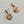 Load image into Gallery viewer, Rose gold earrings with gemstones on a light gray background

