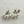 Load image into Gallery viewer, Pair of pearl earrings on a textured white surface
