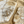 Load image into Gallery viewer, Gold earrings with diamond accents on a marble surface
