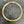Load image into Gallery viewer, A gold-toned metal link chain necklace or choker laid flat on a dark gray textured surface.

