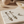 Load image into Gallery viewer, Geometric earrings on a marble surface with a neutral background
