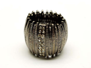 Silver ring with textured design and embedded stones on a white background