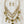 Load image into Gallery viewer, Necklace and earrings set with green and clear stones on a dark surface
