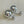 Load image into Gallery viewer, Pair of silver ball earrings on a light gray background
