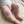 Load image into Gallery viewer, Baby wearing pink knitted knee pads on a beige surface
