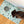 Load image into Gallery viewer, Dog standing on a terrazzo-patterned mat with a bowl, on a wooden floor.
