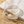 Load image into Gallery viewer, Silver bracelet with pearls on a marble surface with sand
