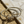 Load image into Gallery viewer, Gold and silver bangles with anchor designs on a marble surface.
