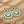 Load image into Gallery viewer, Pair of green marbled earrings with gold accents on a white background
