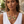 Load image into Gallery viewer, A woman wearing a chunky statement necklace with large oval orange and yellow cabochons set in silver, paired with matching drop earrings and a white sleeveless top.

