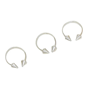 Silver hoop earrings with spike details on a white background