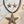 Load image into Gallery viewer, Starfish-shaped jewelry set on a wooden surface with shells.
