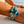 Load image into Gallery viewer, Decorative bracelet with floral design on a wrist by the beach
