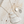 Load image into Gallery viewer, Silver necklace and earrings on a wooden surface
