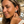 Load image into Gallery viewer, Woman wearing a diamond earring on a beach
