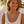 Load image into Gallery viewer, Woman wearing a gold necklace with a circular design outdoors
