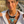 Load image into Gallery viewer, Woman wearing a large, ornate necklace with turquoise stones outdoors.

