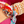 Load image into Gallery viewer, Colorful patterned headband with a pink and orange design, worn by a person with a beaded bracelet on a red background.
