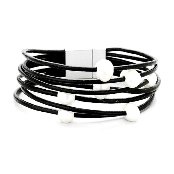 Black leather bracelet with white beads on a white background