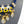 Load image into Gallery viewer, A close-up of a statement bib necklace displayed on a dark gray mannequin bust. The necklace features a royal blue braided cord base with gold-tone metal accents, white rectangular inlays, black teardrop crystals, and dangling faceted clear glass beads with gold caps.
