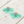 Load image into Gallery viewer, Turquoise tassel earrings with pink and gold center on a wooden surface
