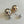 Load image into Gallery viewer, Pair of silver spherical earrings on a light gray background
