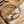 Load image into Gallery viewer, Gold bracelet with anchor design on a stone surface
