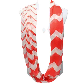 Red and white chevron patterned scarf on a mannequin against a gray background
