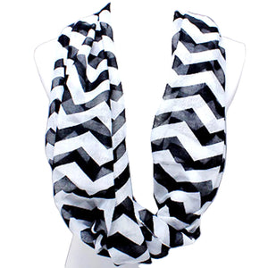 Black and white chevron patterned scarf on a mannequin against a light gray background