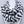 Load image into Gallery viewer, Black and white patterned scarf on a mannequin against a gray background
