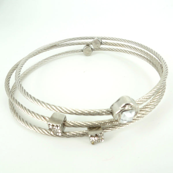 Silver cable bracelet with heart-shaped clasp on a white background