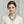 Load image into Gallery viewer, A multi-strand turquoise beaded necklace with small coral accents and a polished silver centerpiece, displayed on a textured gray jewelry bust.
